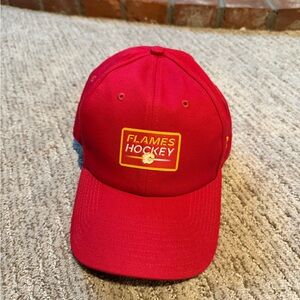 Women’s fanatics red Calgary flames authentic pro adjustable hat.